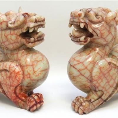 A Large late 19th c. Pair of Carved Chinese Red Jade Nephrite Mythical Pixiu. Each depicted on all fours with tail curled by back lion's...