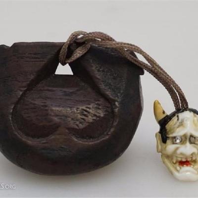 Antique Japanese wooden sagemono netsuke in the form of a Mokugyo fish. With older very detailed composite Hannya head with rhinestone eyes.
