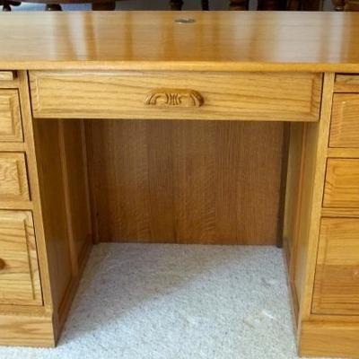 Solid oak desk with finished back.