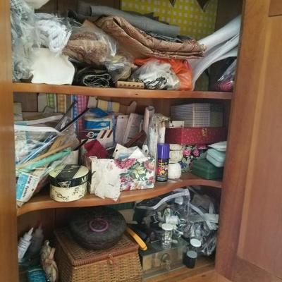 notions and fabric samples stored in hall closet