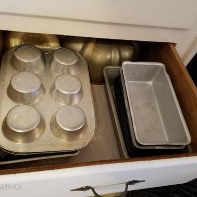 kitchen supplies some new some antique, cake pans, pots oven ware, and more.