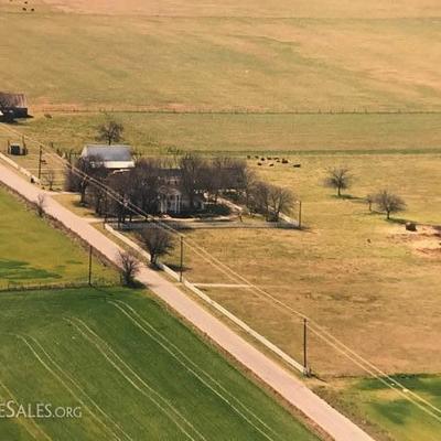 Acreage for sale. with cottage and house, barn, three car garage, fenced and and ready to move in, now!