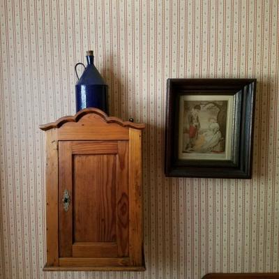 wooden kitchen cabinet, royal blue tin pitcher on top