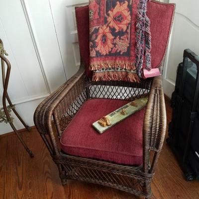 wicker chair currently in sun room and beautiful Colonial stye home