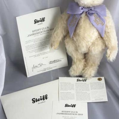 Steiff Creme Edition 2010-293.  The Steiff Club  Annual Edition 2010 collector's bear wears a  lavender ribbon bow around it's...