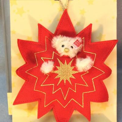 Steiff Teddy in a Red Star Ornament 714 in white  mohair.  'Shine on Teddy'.  This white teddy bear  with gold embroidered nose and mouth...
