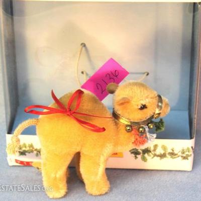 Steiff Dromedary Camel Ornament in beige mohair.   North American Exclusive.  This honey beige camel  is decorated with a harness,...
