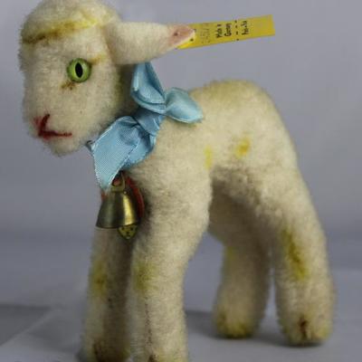 Lamby (lamb)-134 Yellow Lamb.  Has light green  eyes with a blue ribbon neck bow and small brass  bell. Size:  4" H Excellent...