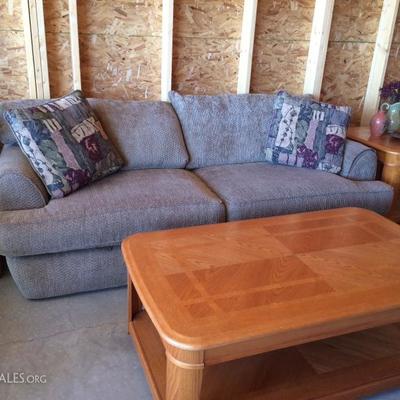 Very nice living room set.  Has oak coffee table and matching end tables 