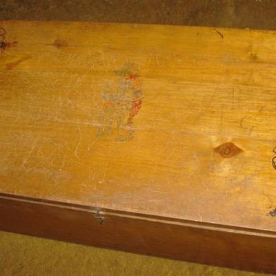 Childs toy box with cowboys out the top 