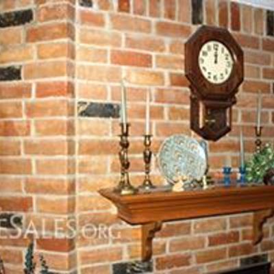 Brass candlesticks, artwork, wall clock, candlesticks