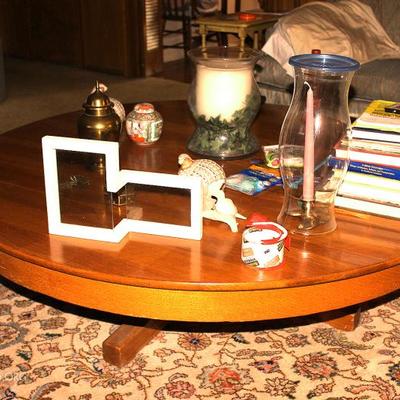 Antique coffee table, candles, books, ginger jars