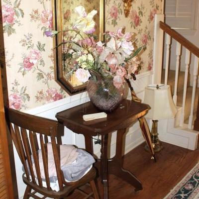 Antique table, chair, floral arrangement, lamp, mirror