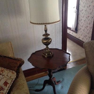 Ruffled tray table and brass lamp