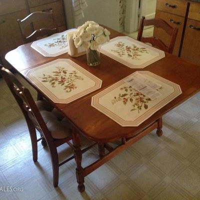 Tidy maple kitchen table and four chairs