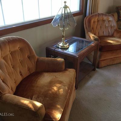 Matching swivel armchairs.