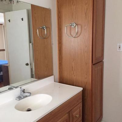 Bathroom sink and cabinets.
