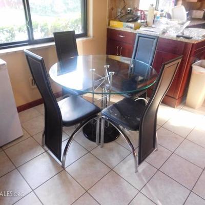 Glass table and 4 chairs $150.00