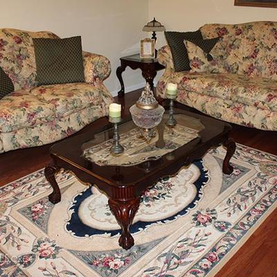 Sofa, loveseat, coffee table, side table, area rug, candlesticks, lamps