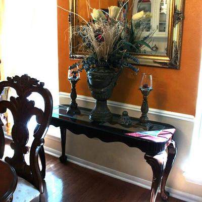 Entry table, mirror, candlesticks, floral arrangement