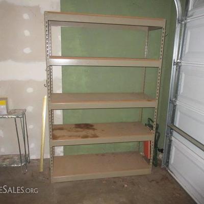 5 shelf metal storage unit and a small side table