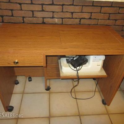 Sewing machine with large extension on table