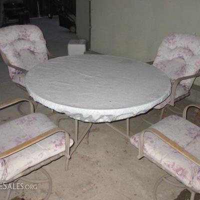 Glass top round patio table with 4 chairs