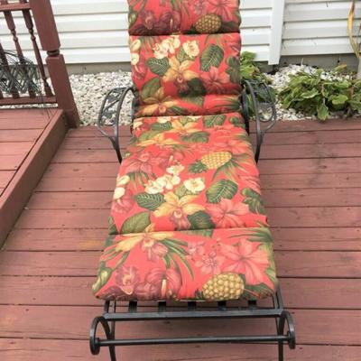 Antique wrought iron lounge chair with cushion