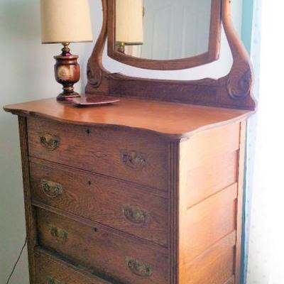 Nice oak chest of drawers with attached mirror.  Good condition