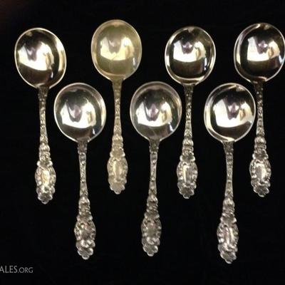 7 ANTIQUE GEO. W. SHIEBLER STERLING SILVER SOUP SPOONS, FLORA PATTERN, APPROX 6.75"L, MONOGRAMMED, APPROX 412 GRAMS TOTAL STERLING...