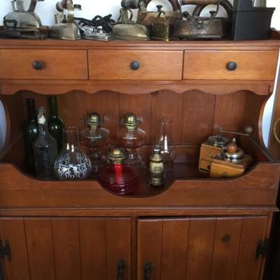 Colonial Style Cabinet, Antique Flat- Irons and SAD Irons, Trivets, Oil Lanterns, Grinders/Mills