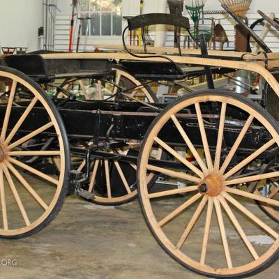 Antique horse-drawn utility wagon with new, Amish-made buggy shafts.