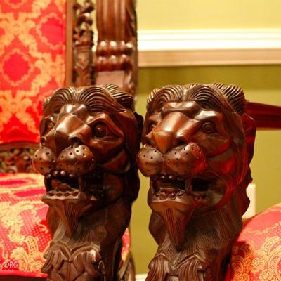 detail of lion heads on arm rests