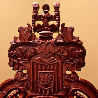 detail of carved wood on chair back