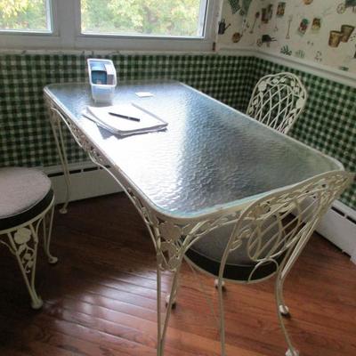 GLASS  TOP TABLE AND THREE CHAIRS
