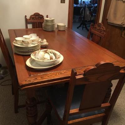antique dining room set with 5 chairs and hidden leaves under table