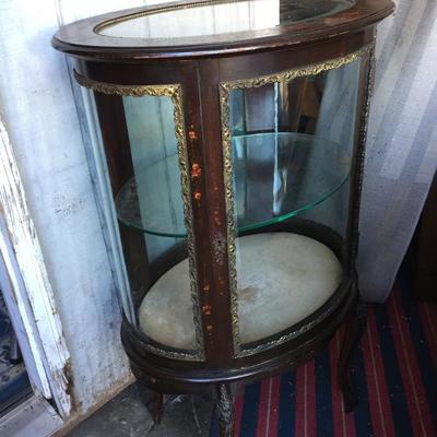 Rare antique glass curio cabinet.