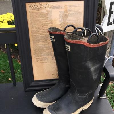 Vintage black deacon's bench, fireman's boots and a framed copy of the constitution.
