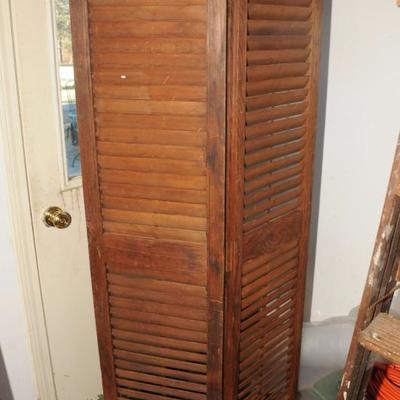 
SHUTTERS MADE INTO ROOM DIVIDER