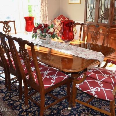 Table with leaves plus 8 side chairs and 2 upholstered captain's chairs