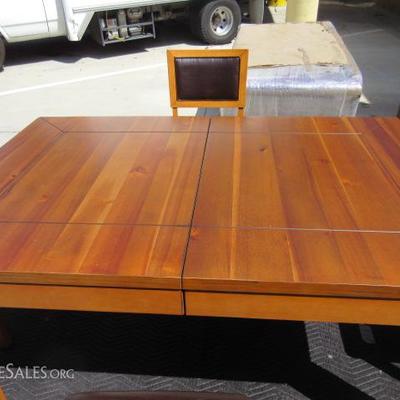 Gorgeous solid wood dining room table with 4 leather chairs