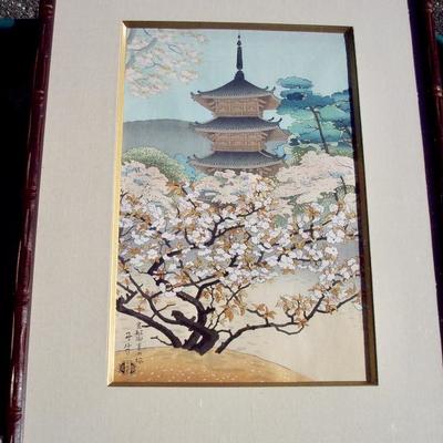 VINTAGE JAPANESE WOODBLOCK IN COLORS FEATURING A PAGODA HIDDEN BEHIND A BLOSSOMING FLOWERING TREE. ARTIST BLIND STAMP & SIGNATURE FINE...