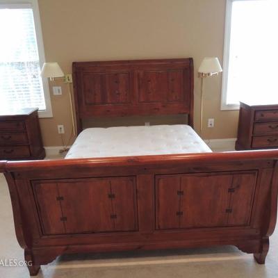 Ashley Furniture queen sleigh bed with pair of side tables and large dresser with mirror. Solid wood