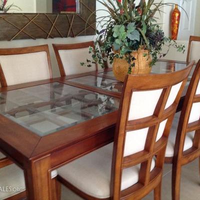 Table shown with 2 extensions and 6 chairs, $375
