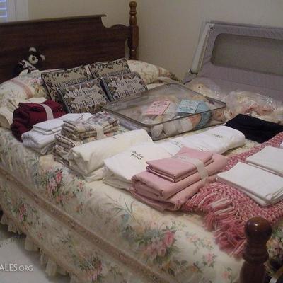 queen size bed with bedding and comforter