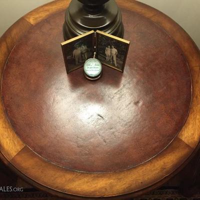 Leather topped round wood occasional table with shelf