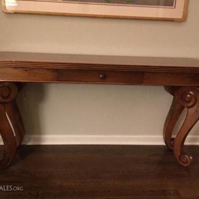 Wood console table with scroll legs
