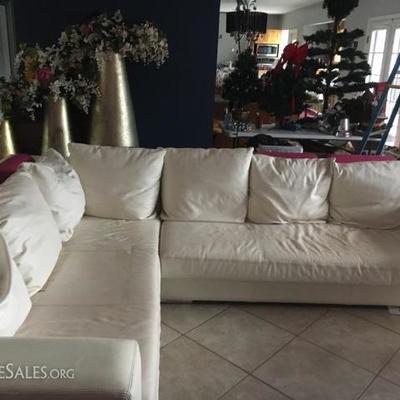 Two-Tone Leather Sectional Sofa with built in table along the back.