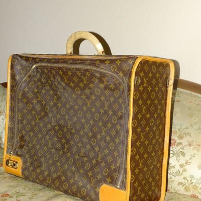Vintage Louis Vuitton suitcase, never used, still has the wrapping on the handle and the directions for the lock inside:  $995