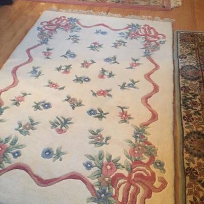 Variety of dozens of persian style and other floor rugs